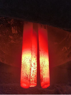 HTEC-video graphite electrodes inside LF furnace for heating molten steel during refining process